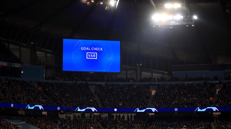 The big screen displays that a VAR goal check is being conducted during the UEFA Champions League quarter final second leg match at the Etihad Stadium, Manchester.