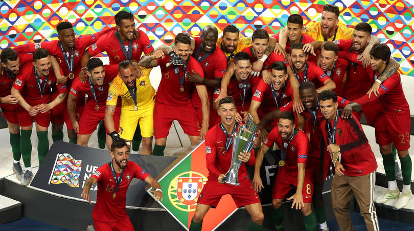 Portugal's Cristiano Ronaldo lifts the Nations League Trophy with team-mates after the Nations League Final at Estadio do Dragao, Porto.