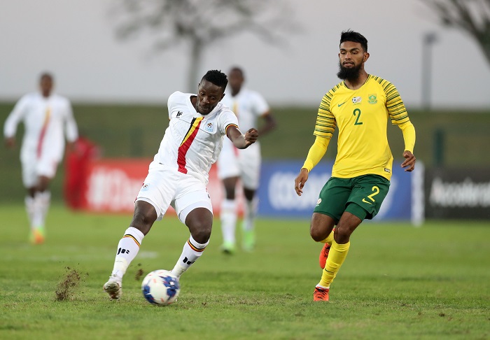 Juma Balinya of Uganda challenged by Keanu Cupido of Bafana Bafana