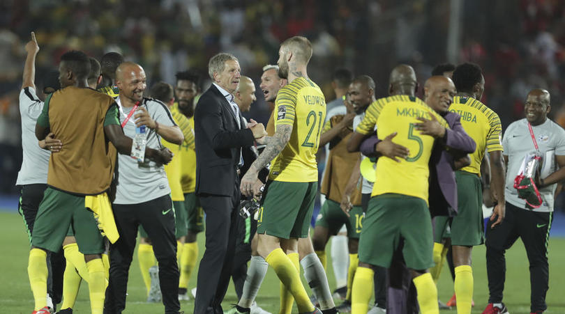 Bafana Bafana head coach Stuart Baxter celebrates with his player after beating Egypt