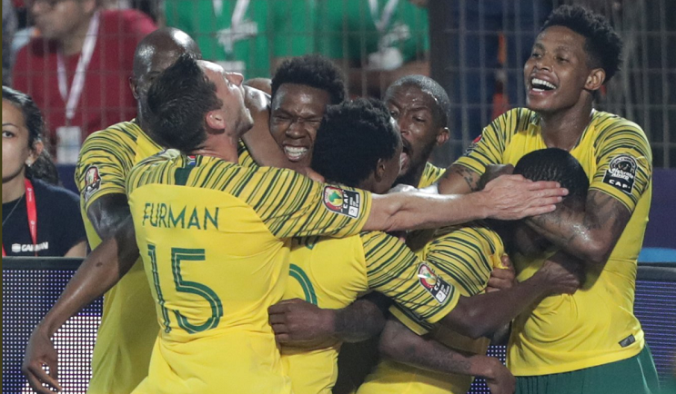 Bafana Bafana players celebrate after Thembinkhosi Lorch netted the winner against Egypt