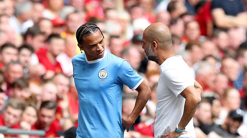 Manchester City's Leroy Sane speaks with Manchester City manager Pep Guardiola as he leaves the pitch injured during the Community Shield match at Wembley Stadium, London.