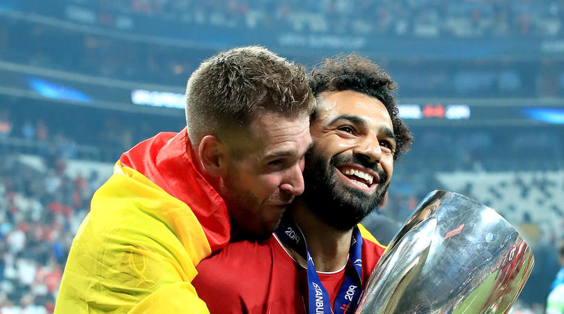 Liverpool goalkeeper Adrian celebrates with team-mate Mohamed Salah (right) after the UEFA Super Cup Final at Besiktas Park, Istanbul.