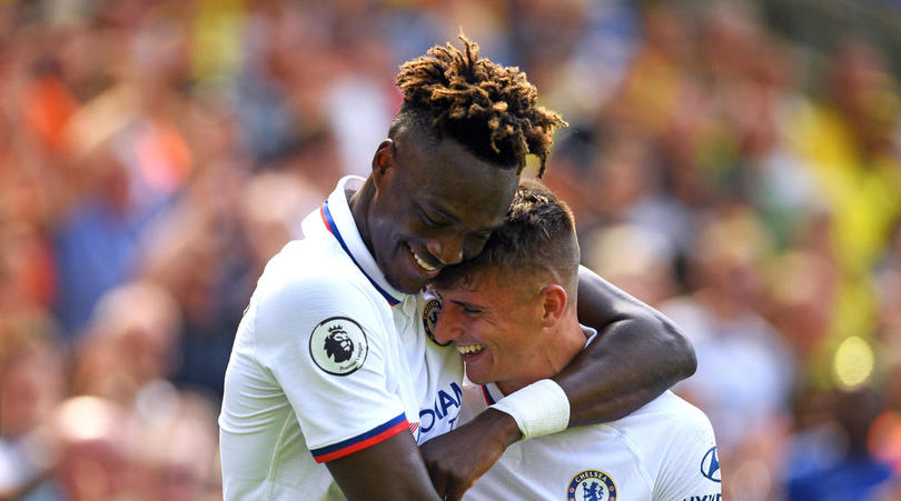 Chelsea's Mason Mount (right) celebrates scoring his side's second goal of the game with Tammy Abraham during the Premier League match at Carrow Road, Norwich.