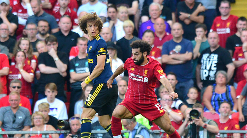 Arsenal's David Luiz (left) and Liverpool's Mohamed Salah battle for the ball during the Premier League match at Anfield, Liverpool.