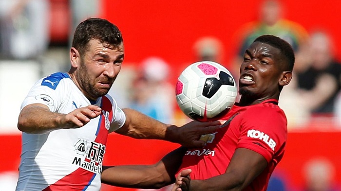 Paul Pogba of Manchester United and James McArthur of Crystal Palace