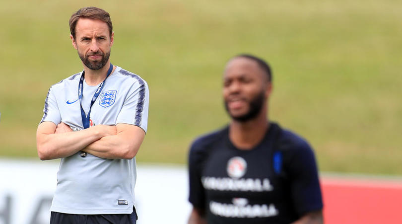 ngland manager Gareth Southgate watches Raheem Sterling during the training session at St George's Park, Burton.