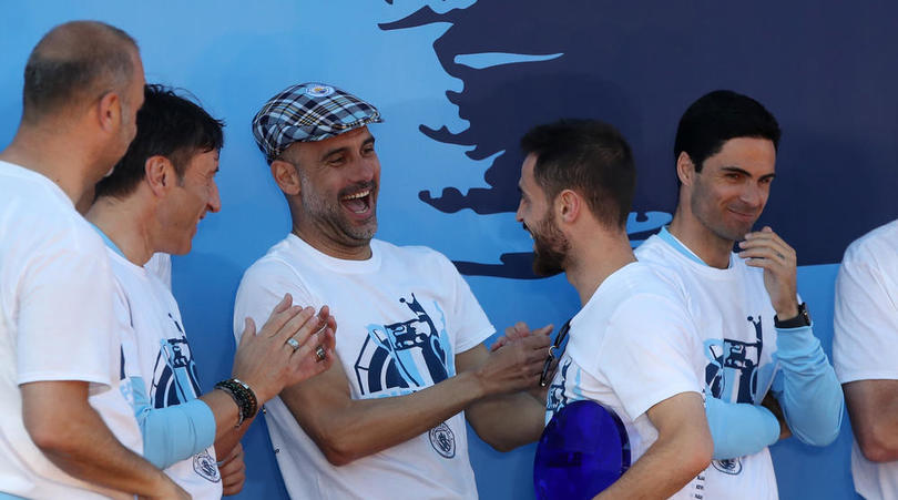 Manchester City manager Pep Guardiola with Bernardo Silva