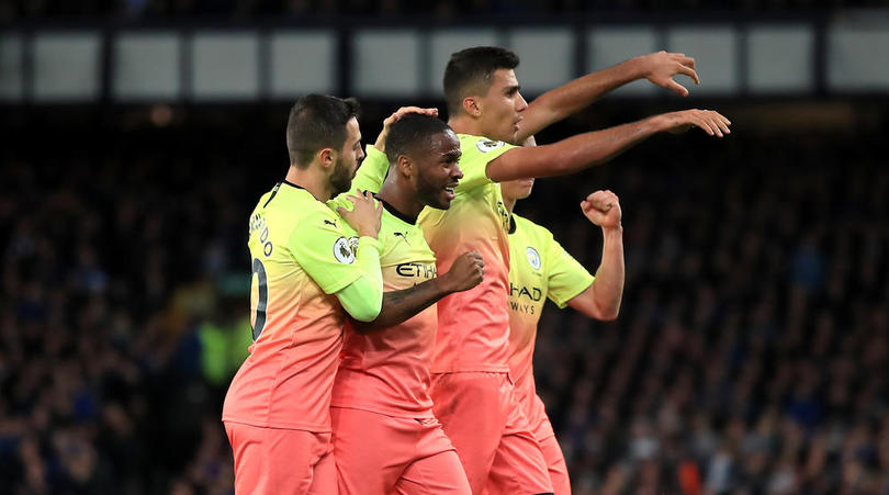 Manchester City's Raheem Sterling celebrates scoring his side's third goal of the game with team-mates during the Premier League match at Goodison Park, Liverpool.