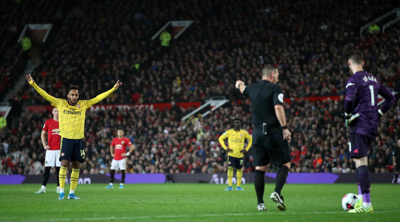 Arsenal's Pierre-Emerick Aubameyang celebrates scoring his side's first goal of the game after a VAR review during the Premier League match at Old Trafford, Manchester.