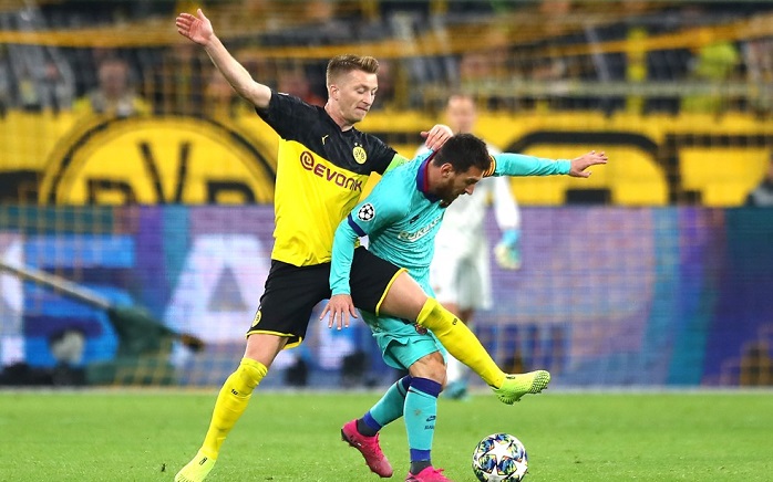 Marco Reus of Borussia Dortmund and Lionel Messi of Barcelona