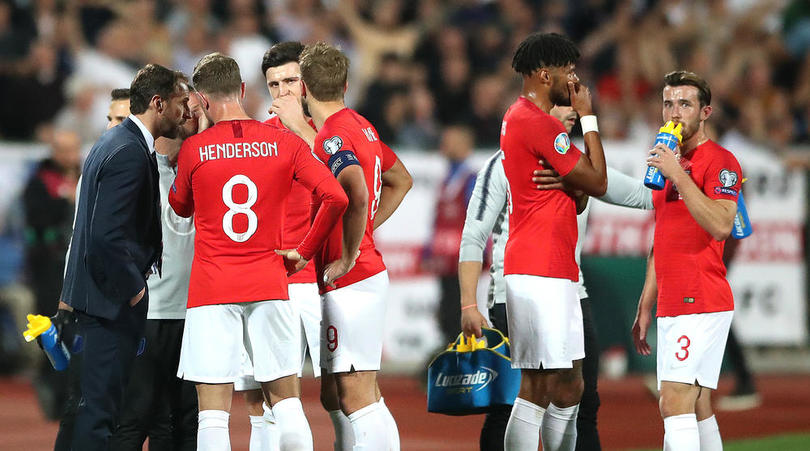 England manager Gareth Southgate speaks to the players with regards to racist chanting from fans