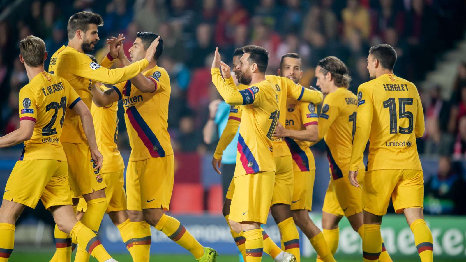 Lionel Messi and his Barcelona teammates celebrate his record breaking goal