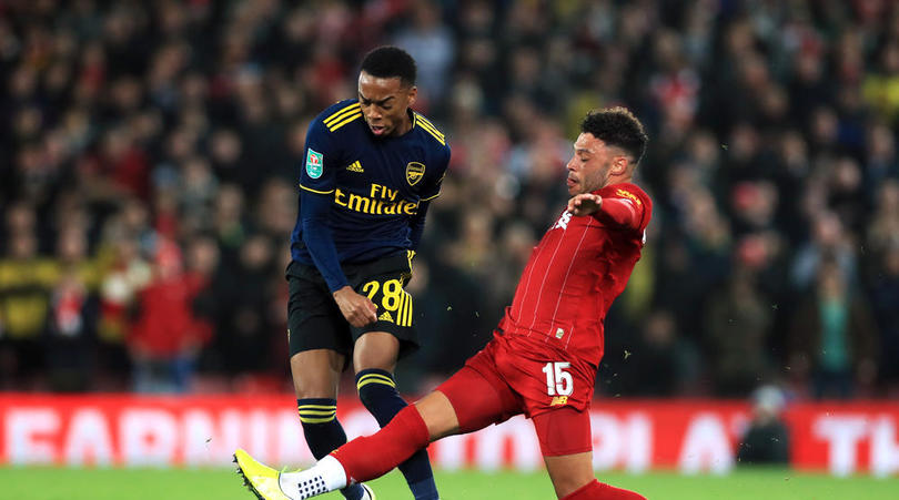 Arsenal's Joe Willock and Liverpool's Alex Oxlade-Chamberlain battle for the ball