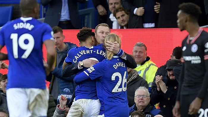 Everton forward Dominic Calvert-Lewin and midfielder Tom Davies rush over to celebrate with caretaker manager Duncan Ferguson