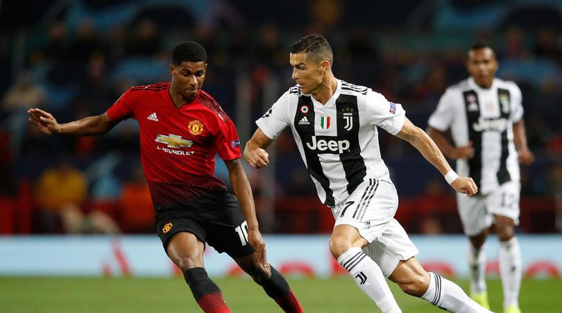 Manchester United's Marcus Rashford (left) and Juventus' Cristiano Ronaldo during the UEFA Champions League match at Old Trafford, Manchester.