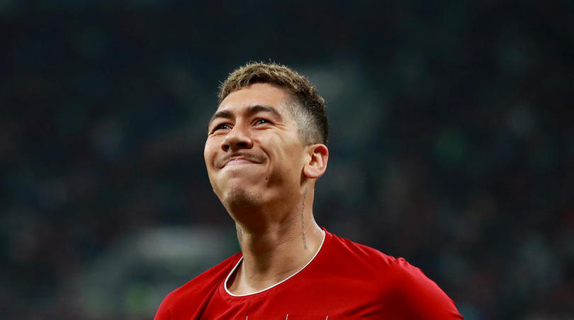 Roberto Firmino of Liverpool celebrates scoring his side's second goal of the game during the FIFA Club World Cup semi final match at the Khalifa International Stadium, Doha.