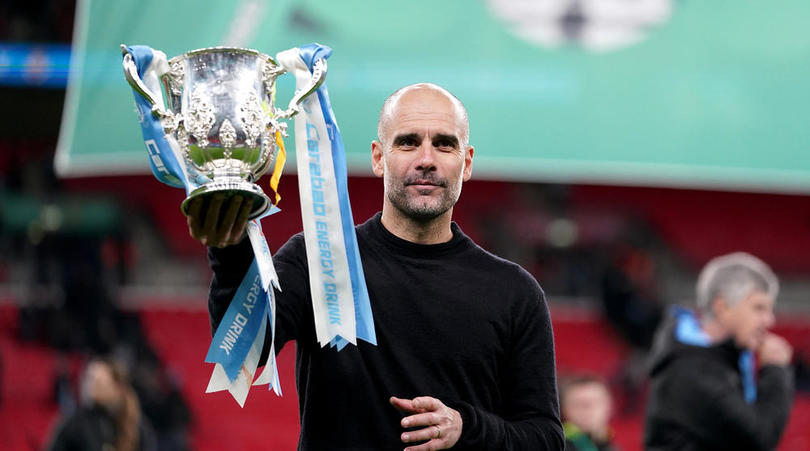 Manchester City manager Pep Guardiola with the trophy after the Carabao Cup Final at Wembley Stadium, London.