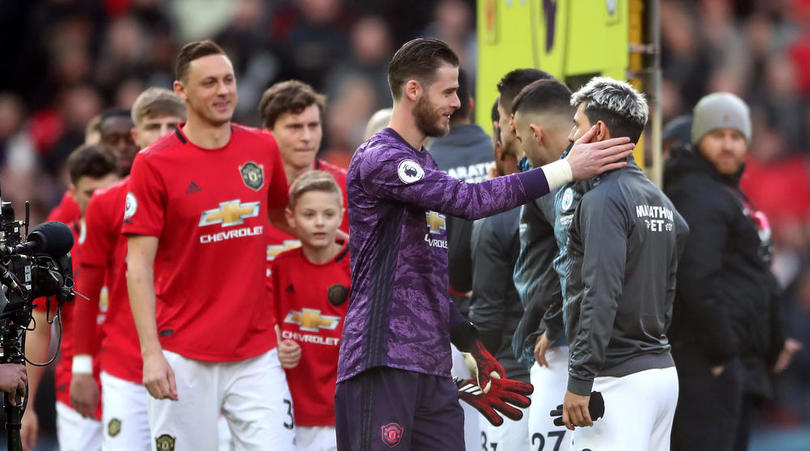 Manchester United goalkeeper David de Gea greets Manchester City's Sergio Aguero during the Premier League match at Old Trafford, Manchester.